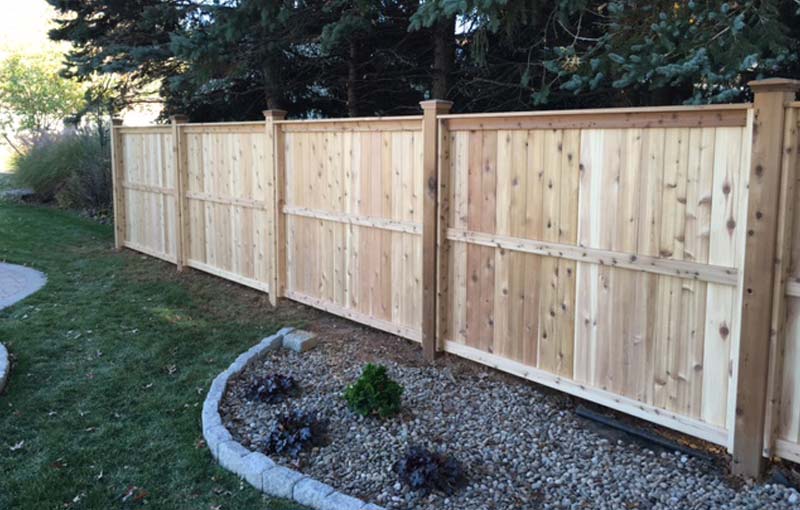 wood fence installation and landscaping